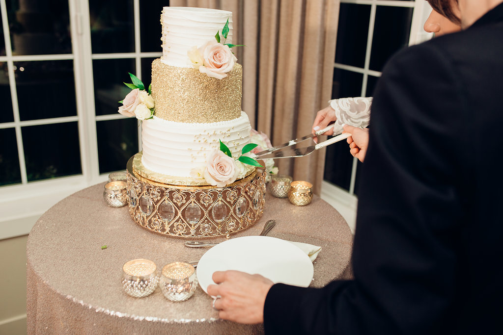 Wedding Photograph Of Bride And Groom  Cutting Through The Wedding Cake Los Angeles