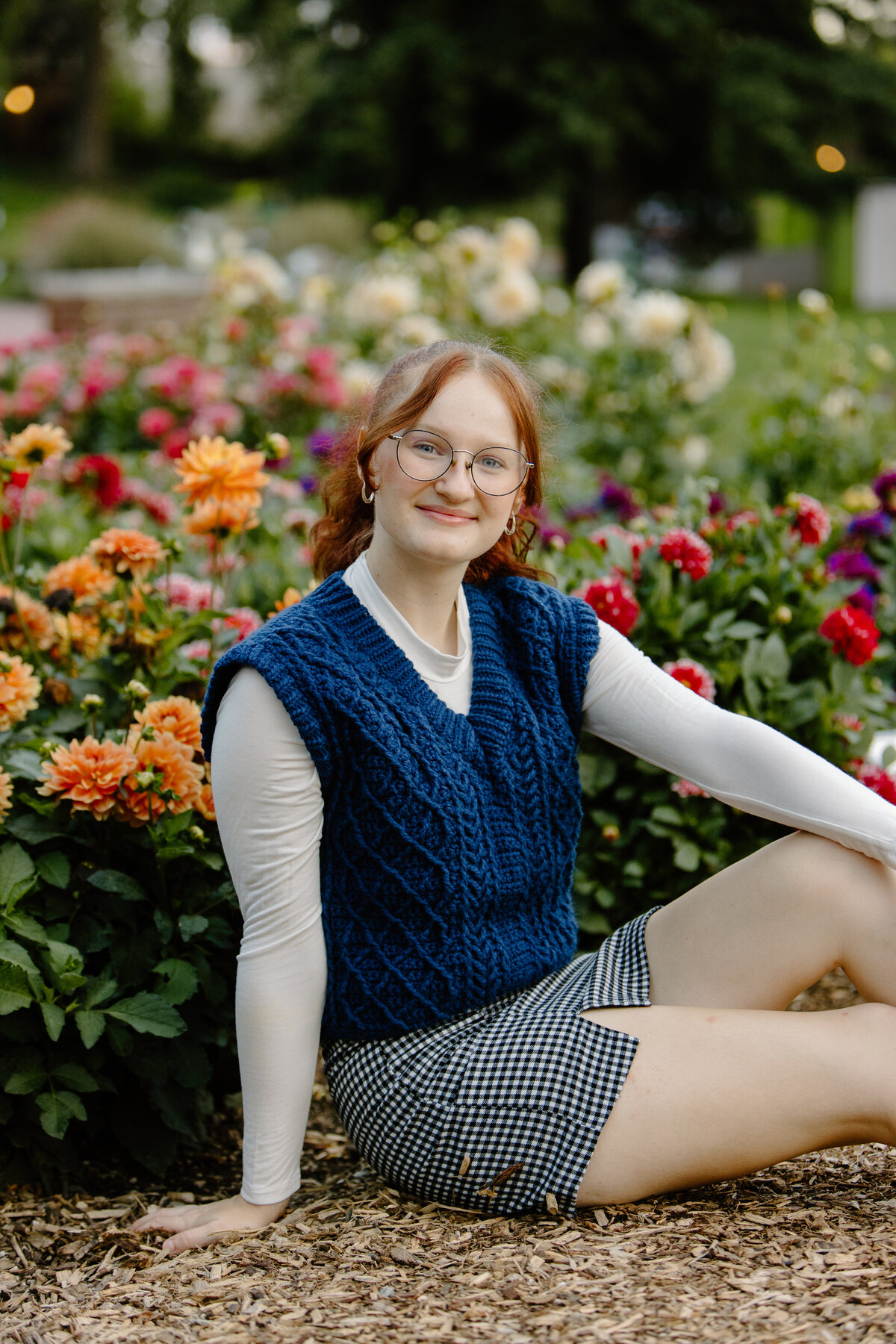 A high school senior poses for a portrait at the CSU Trial Gardens in Fort Collins, Colorado.