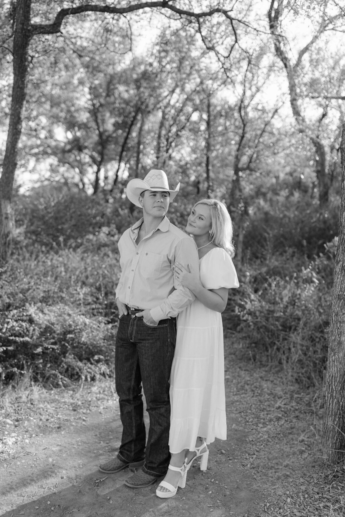 black and white engagement photo of happy couple