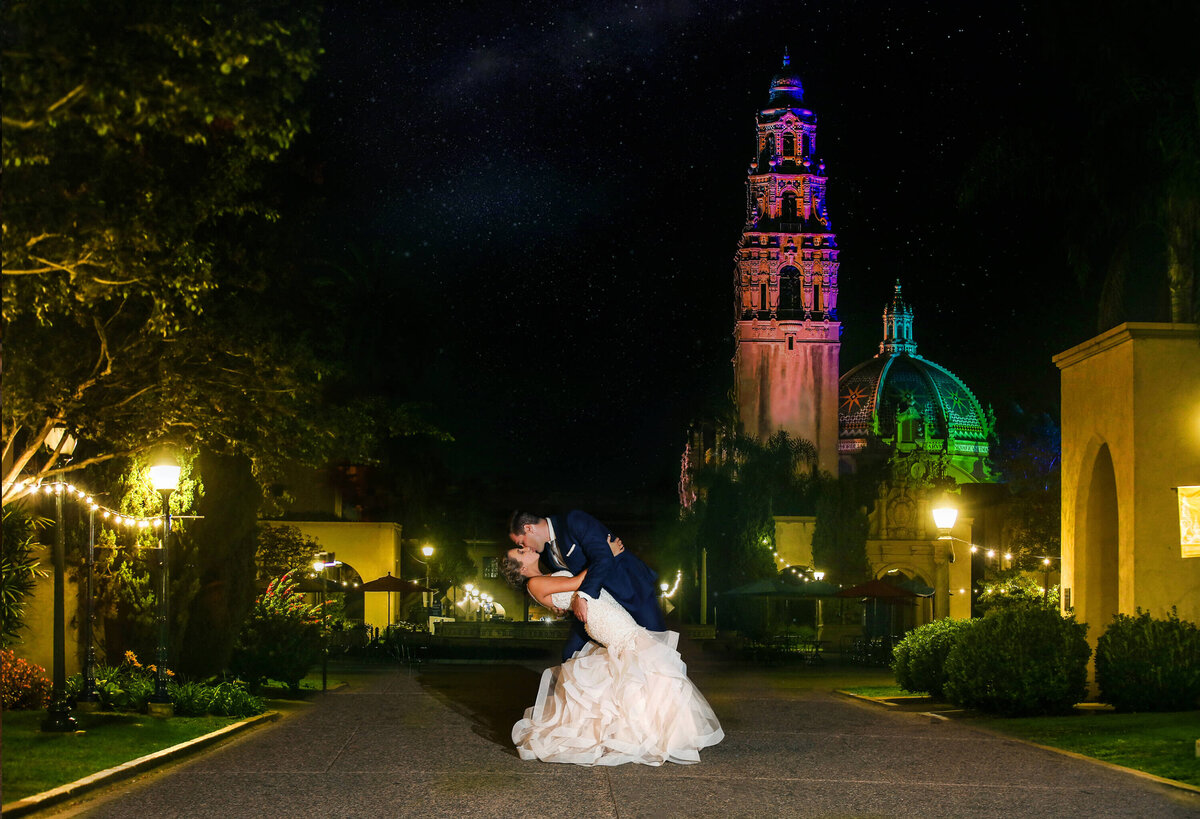 balboa-park-night-wedding-photo-colorful-tower-dip-kiss
