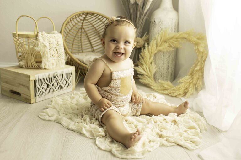 Adorable 6-month-old baby celebrating a fun milestone with a big smile and playful expressions