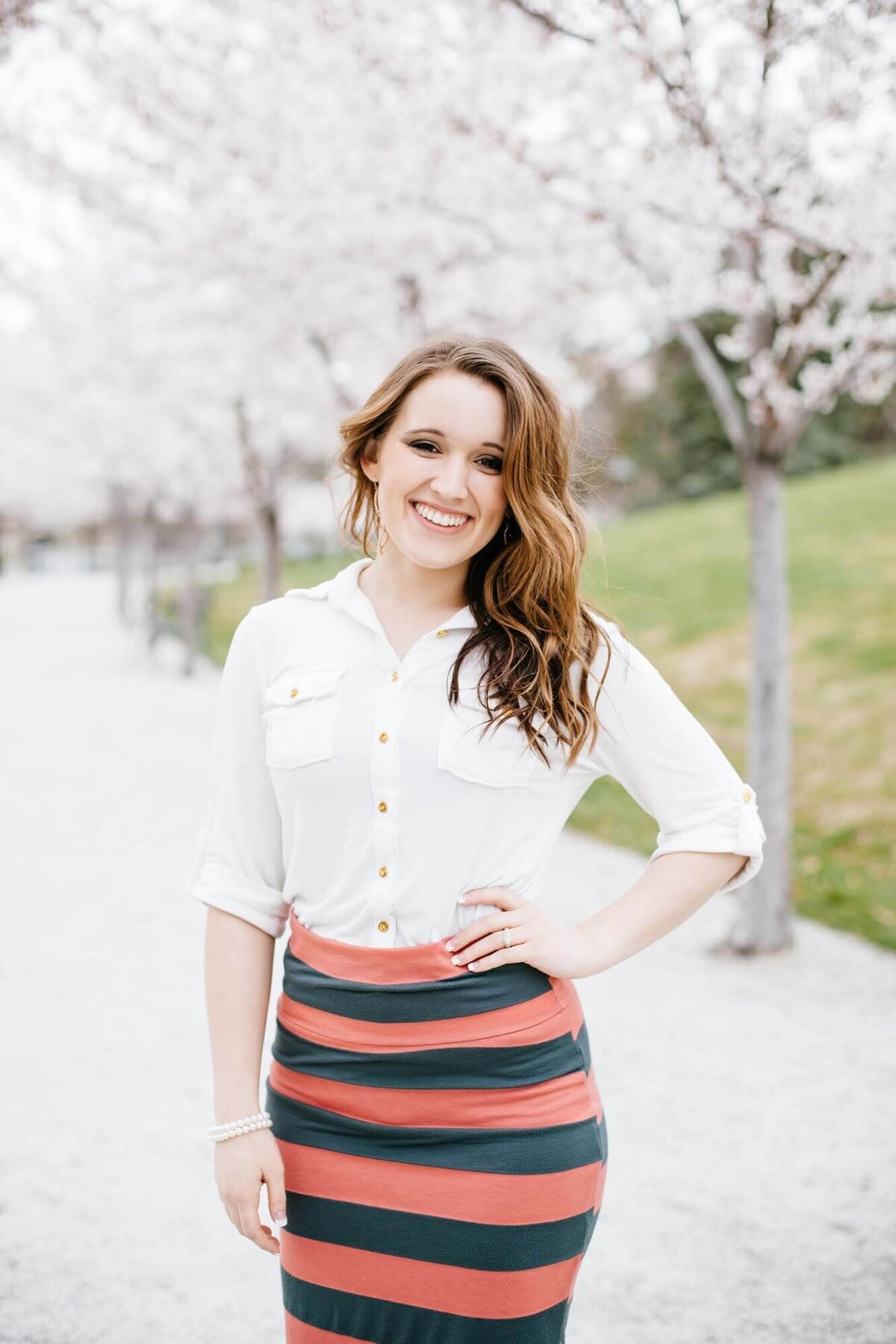 A woman in a white shirt and pencil skirt