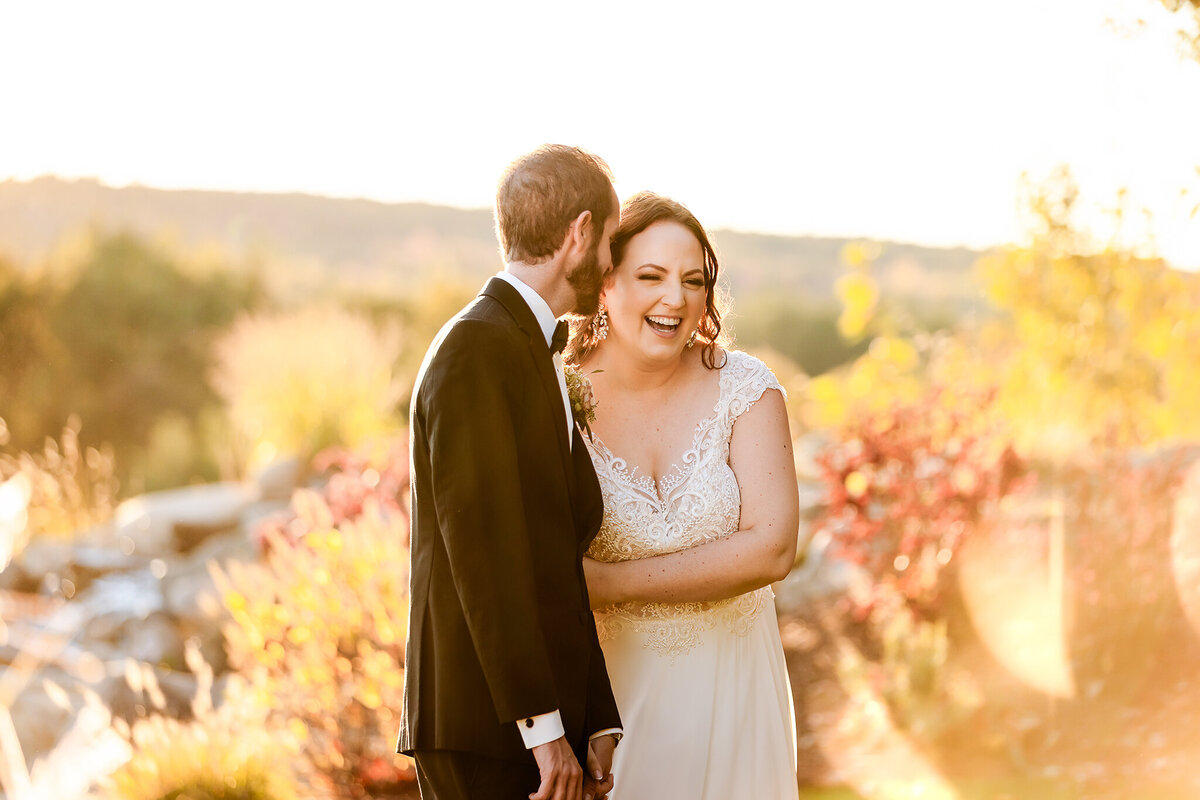 Groom whispering in brides ear at Pembroke Pines Country Club