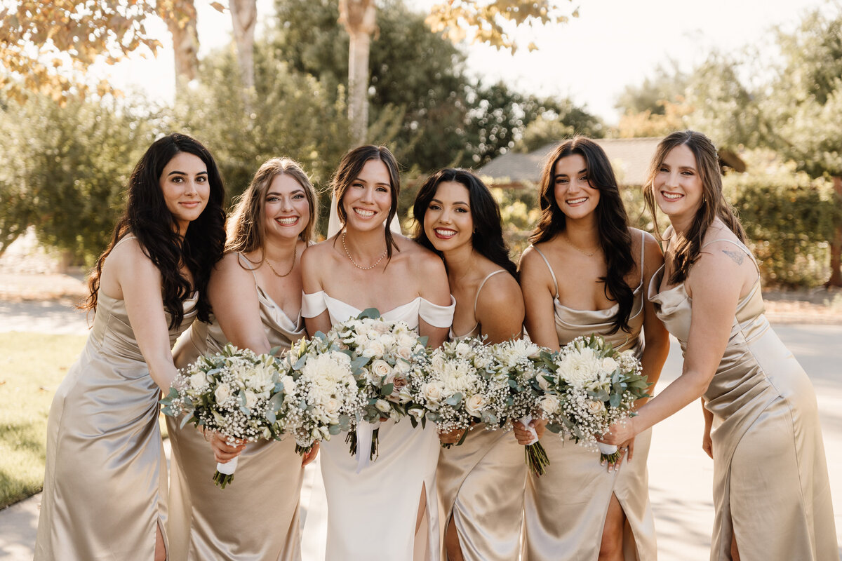 bridesmaids holding bouquets on wedding day