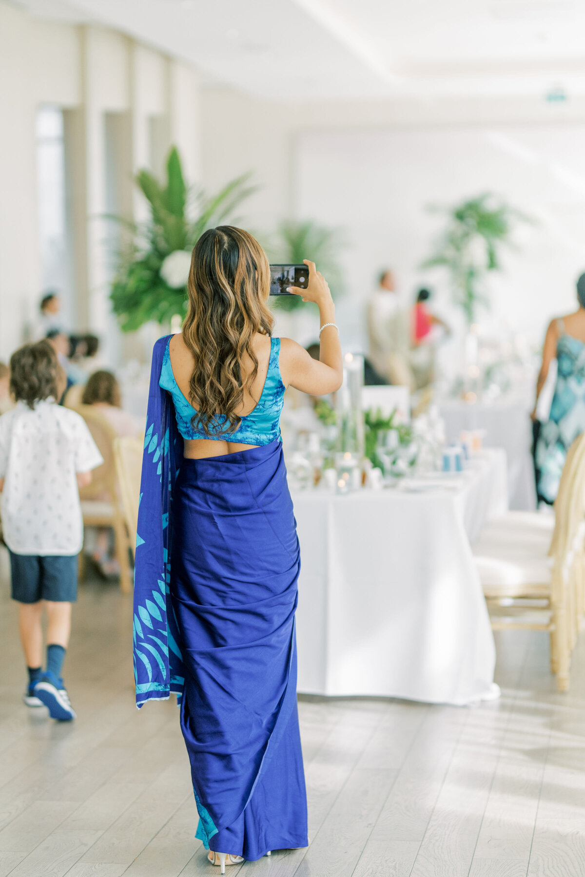 A guest is taking a photo of the venue at the pearle hotel