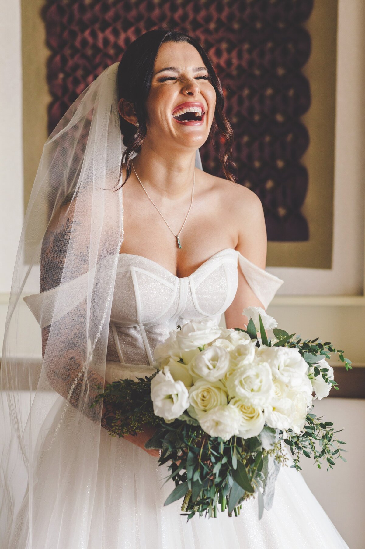 Bride laughing before wedding in Cancun