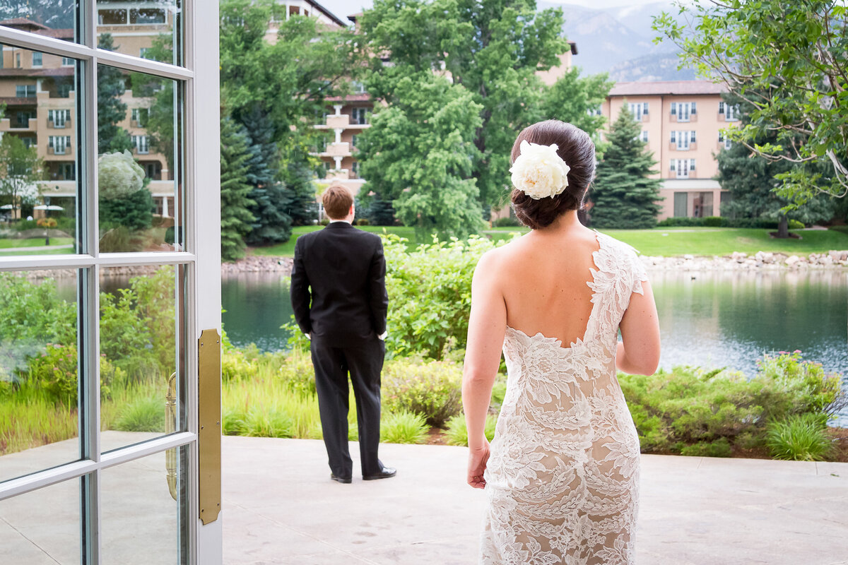 A Bride Approaches her Groom to see each other for the first time, Broadmoor, Lakeside Terrace