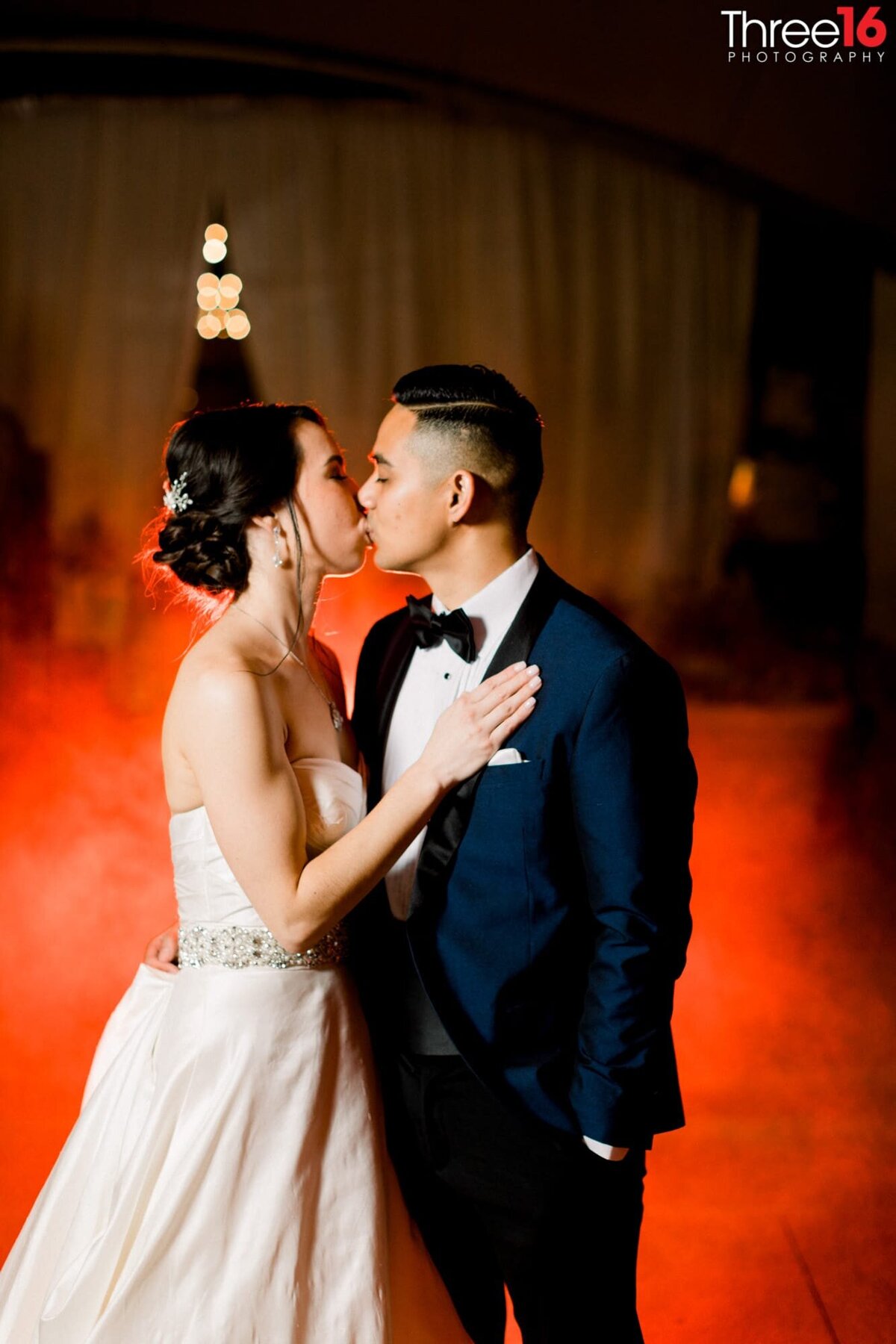 Bride and Groom share a sweet tender kiss