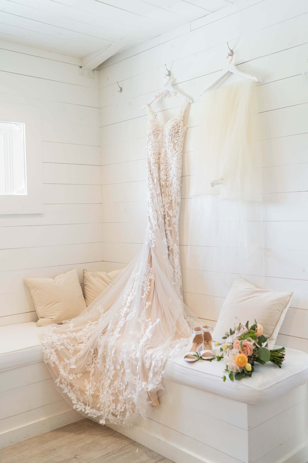 soft-pink-lace-wedding-dress-bridal-heels-floral arrangement