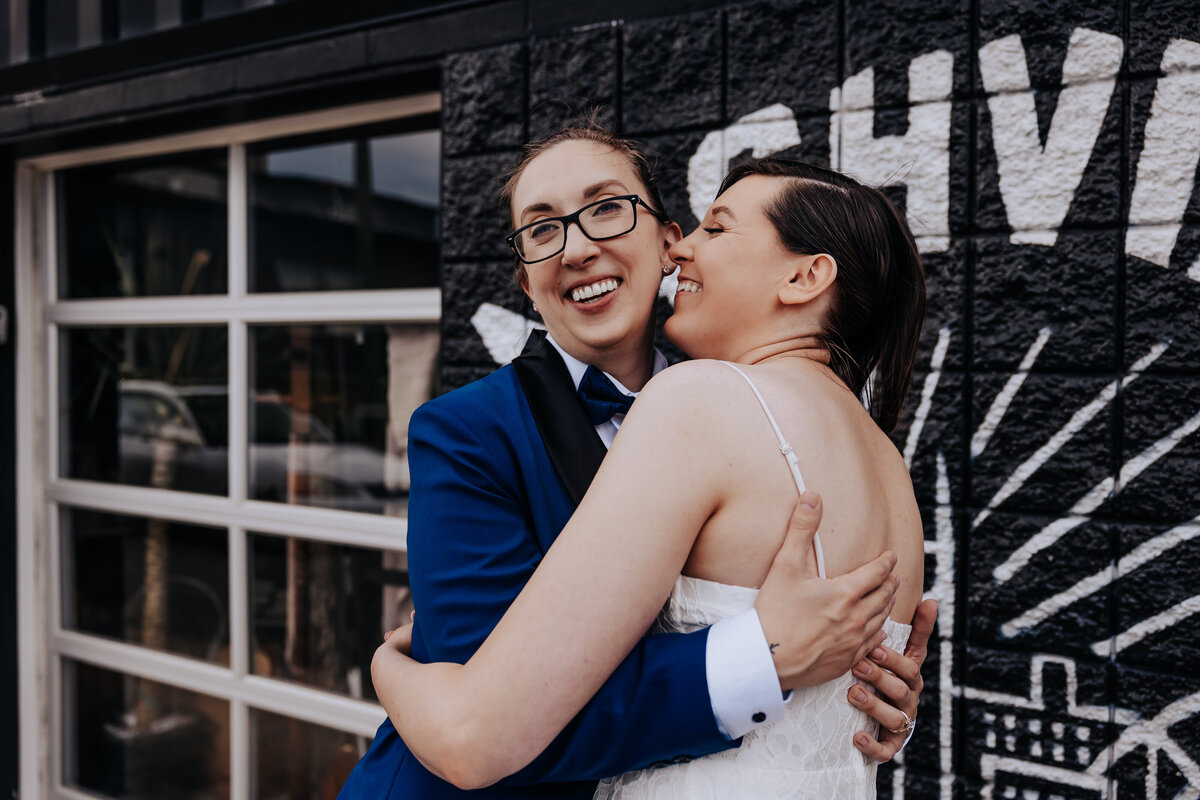 Nashville wedding photographer captures couple hugging during portraits