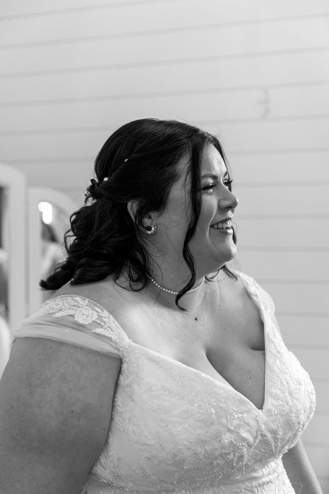 candid moment of the bride smiling and laughing