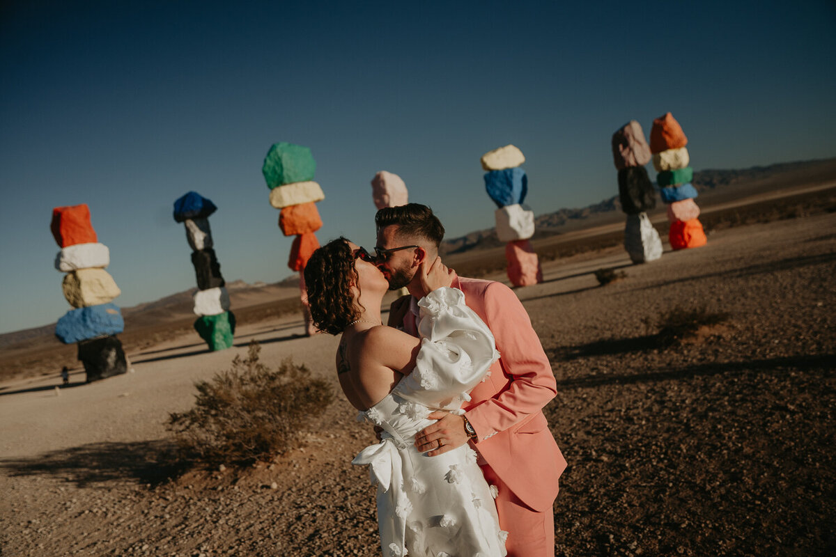 Bride and Groom in front of Seven Magic Mountains in Las Vegas.