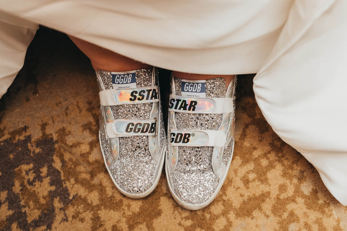Golden Goose sneakers for more comfortable shoes at reception.