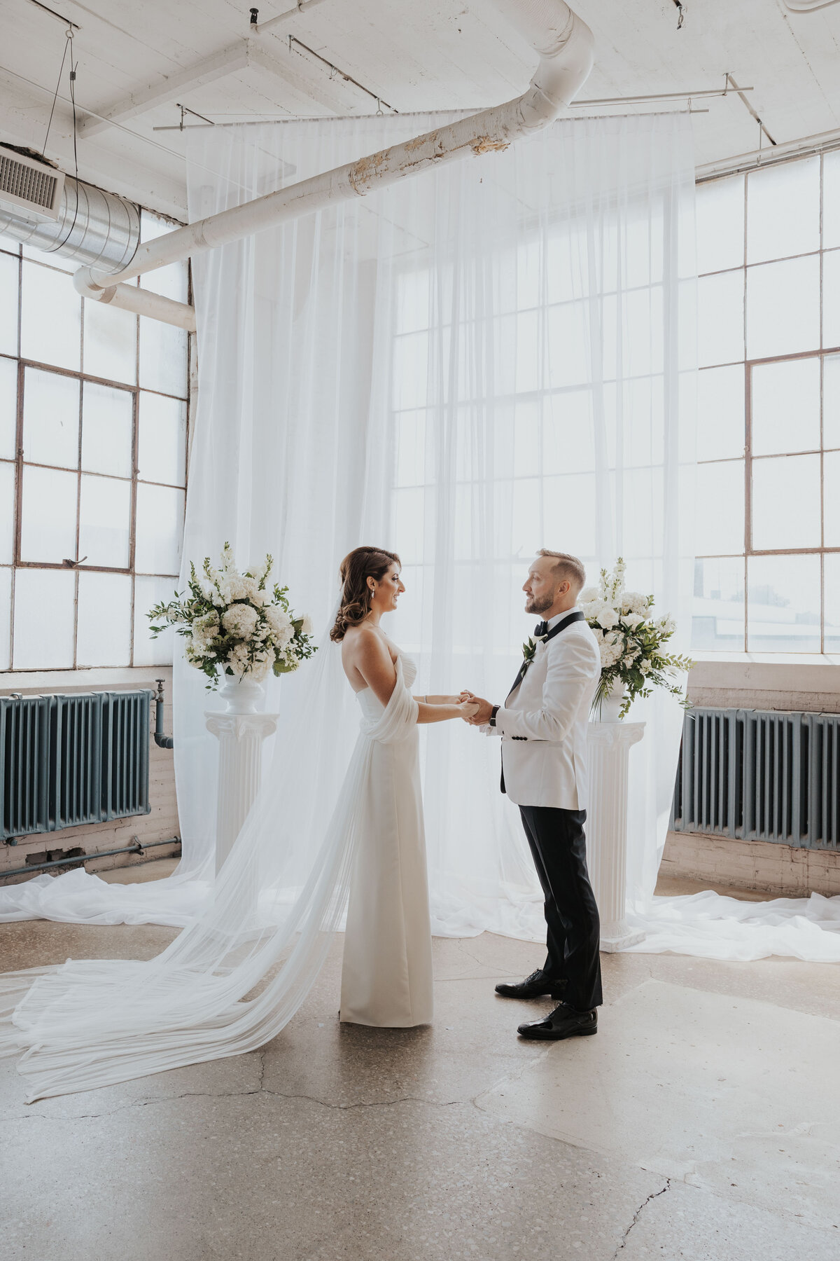 bride and groom at the lake erie buildling