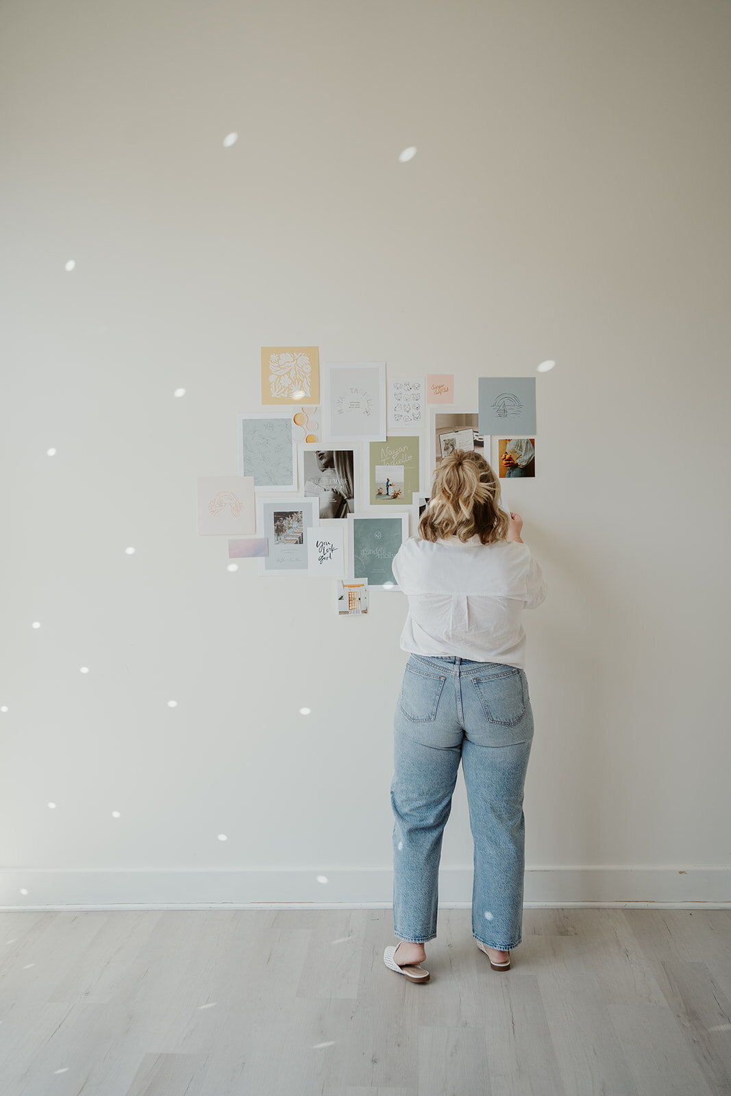 Full view of a curated mood board wall inside a Kalamazoo Michigan studio for a Wildher and Co branding session.