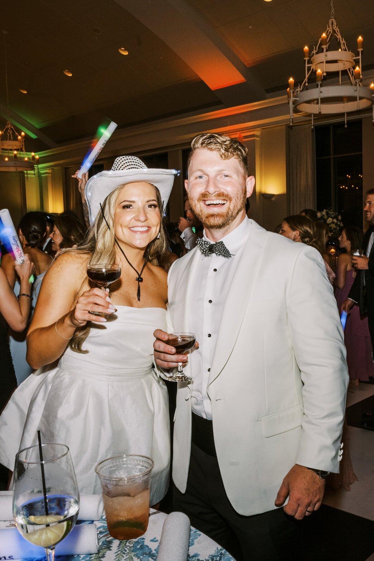 wedding couple cheering on the dance floor