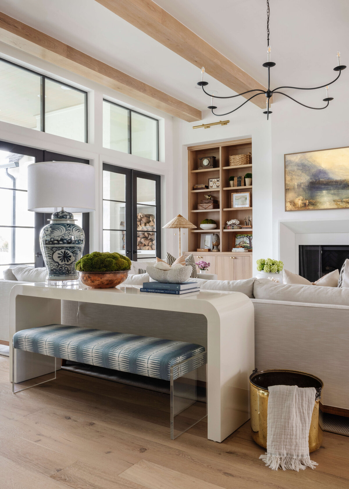 oyster creek studios missouri city new build blue striped stool under white accent table in living room