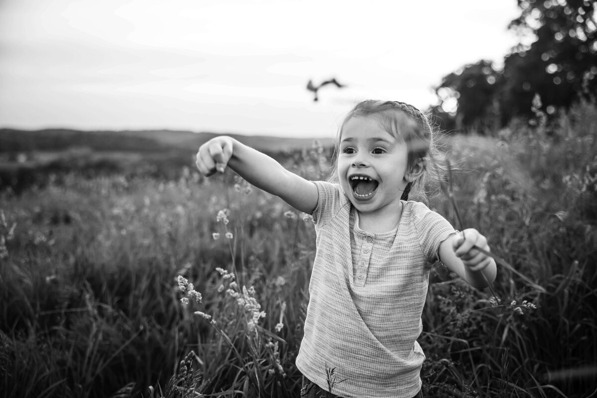 little girl playing in portrait session with reva davis photography