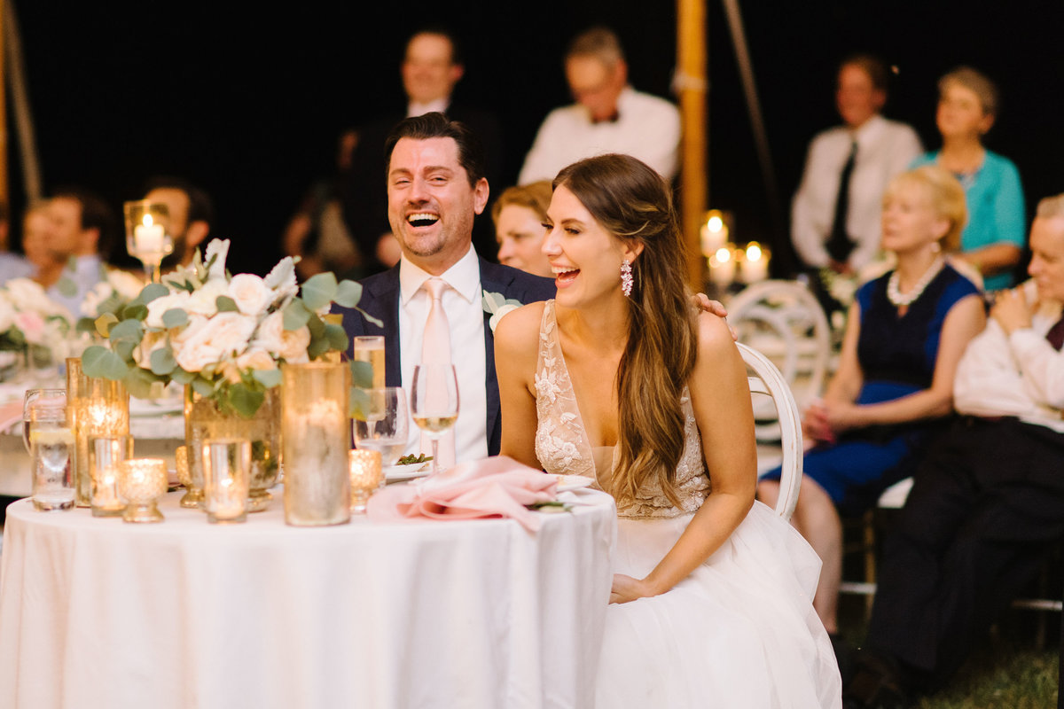 Bride and Groom laugh during wedding toasts speech Charleston wedding