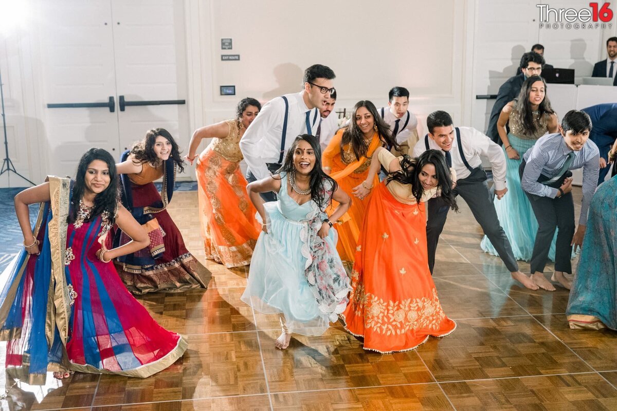Bridal party dances a traditional Indian wedding dance