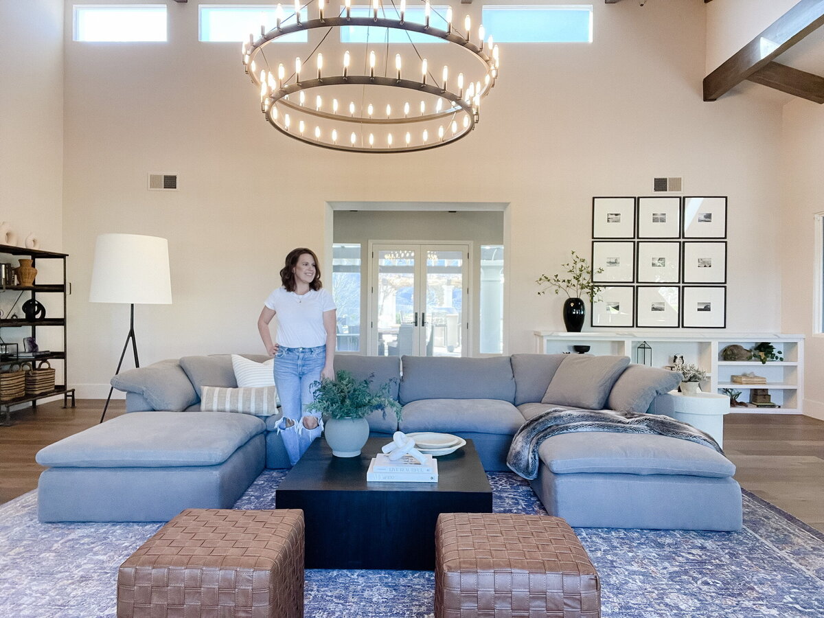 woman posing by couch