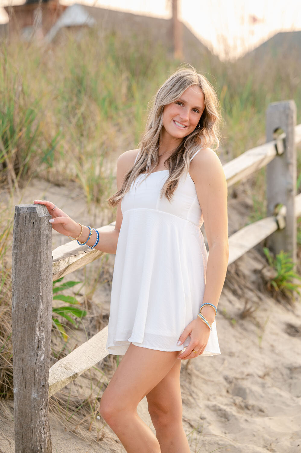 NJ senior photoshoot fun friends shoot cap and gown spring lak sea girt beach shoot white dresses-376