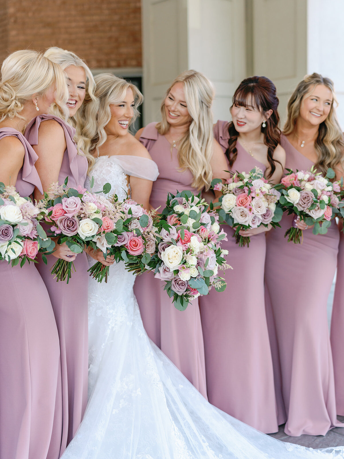 Bridesmaids in long soft blush chiffon dresses