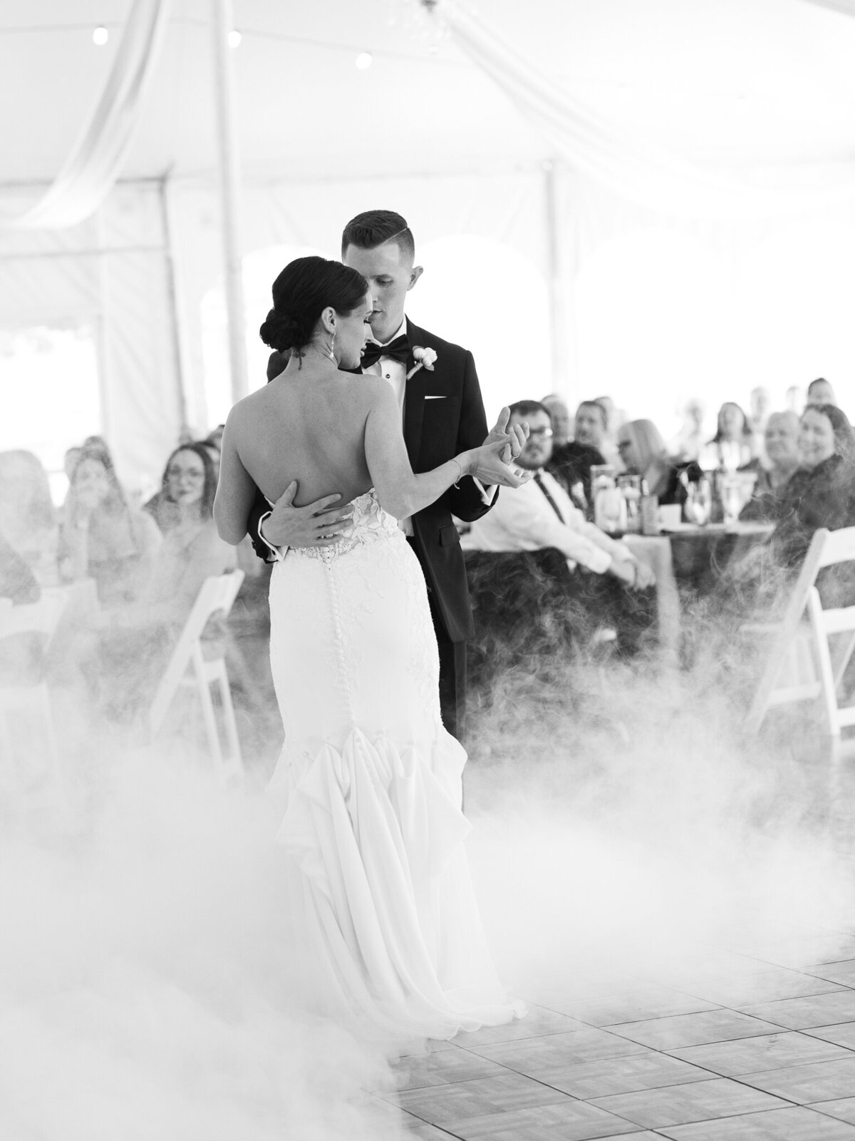Bride and groom first dance with fog effect during elegant wedding reception