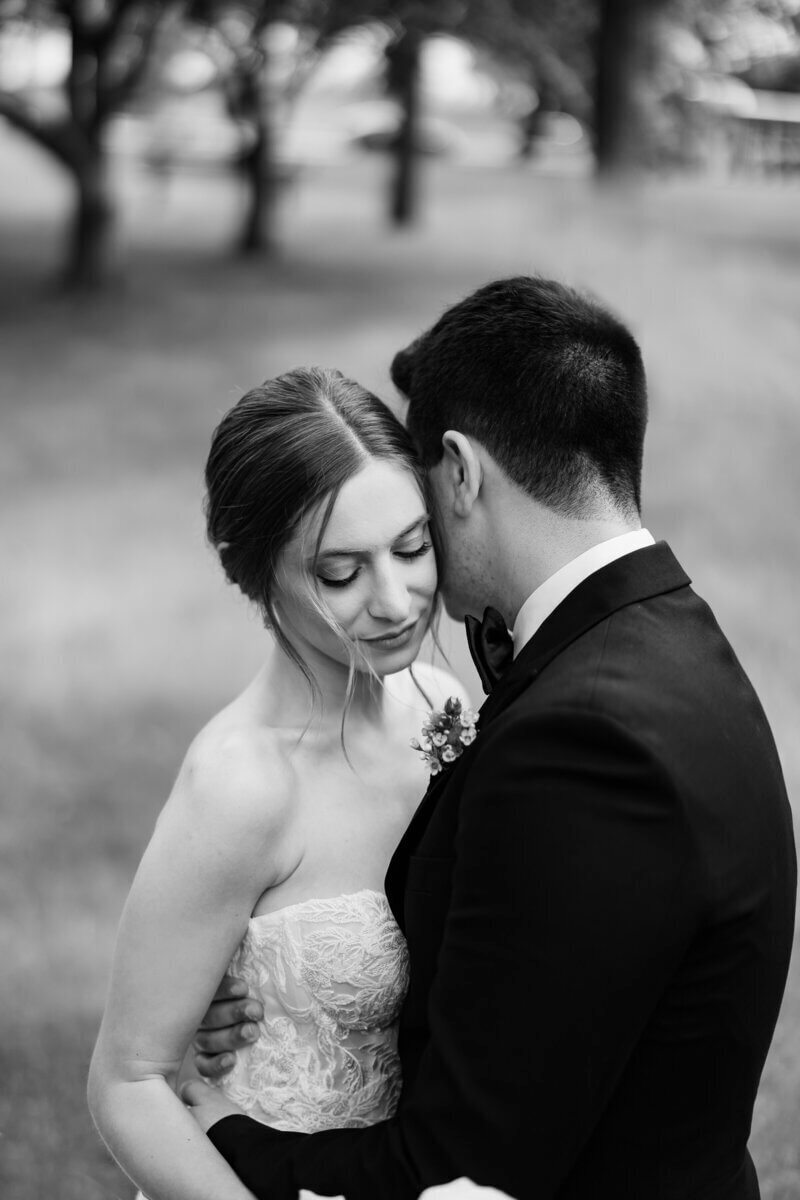 Bride and groom embracing by wedding planners chicago il