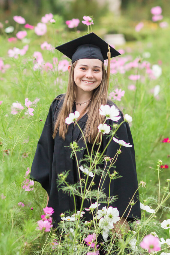 senior-girl-standing-in-wildflowers