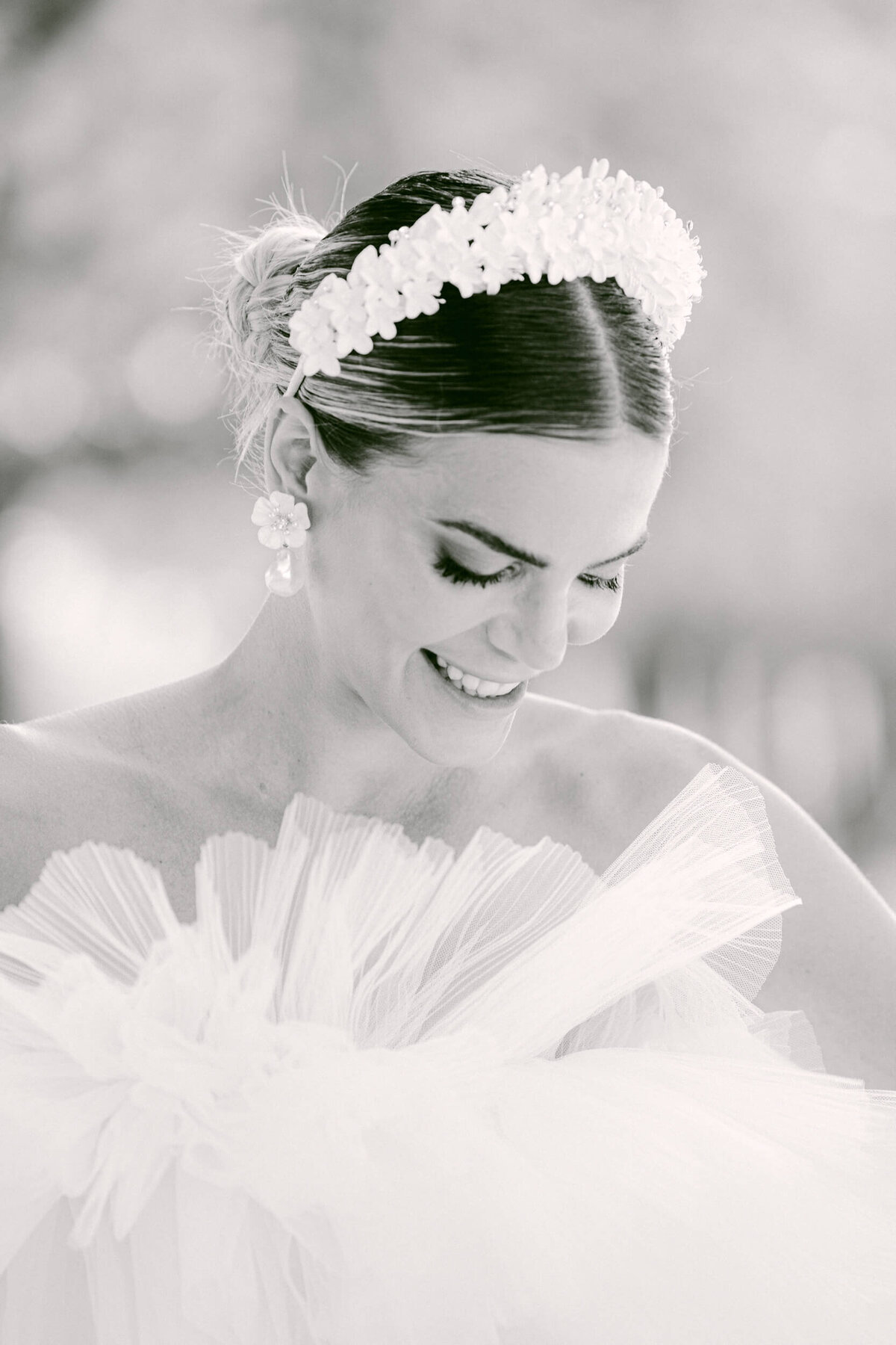 A wedding photo of a bride in her white dress in the streets of Paris in France.