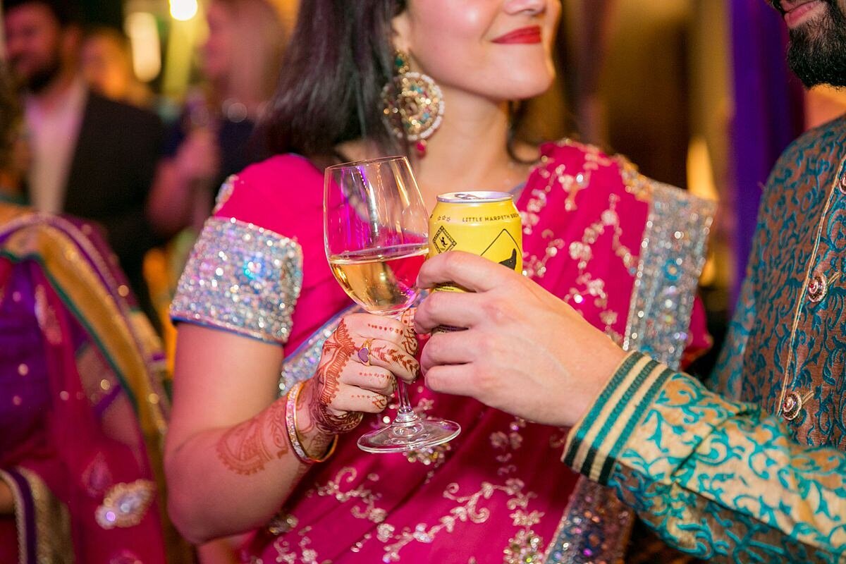 Sheikh bride and Hindu groom share cocktails at a Nashville mendhi celebration