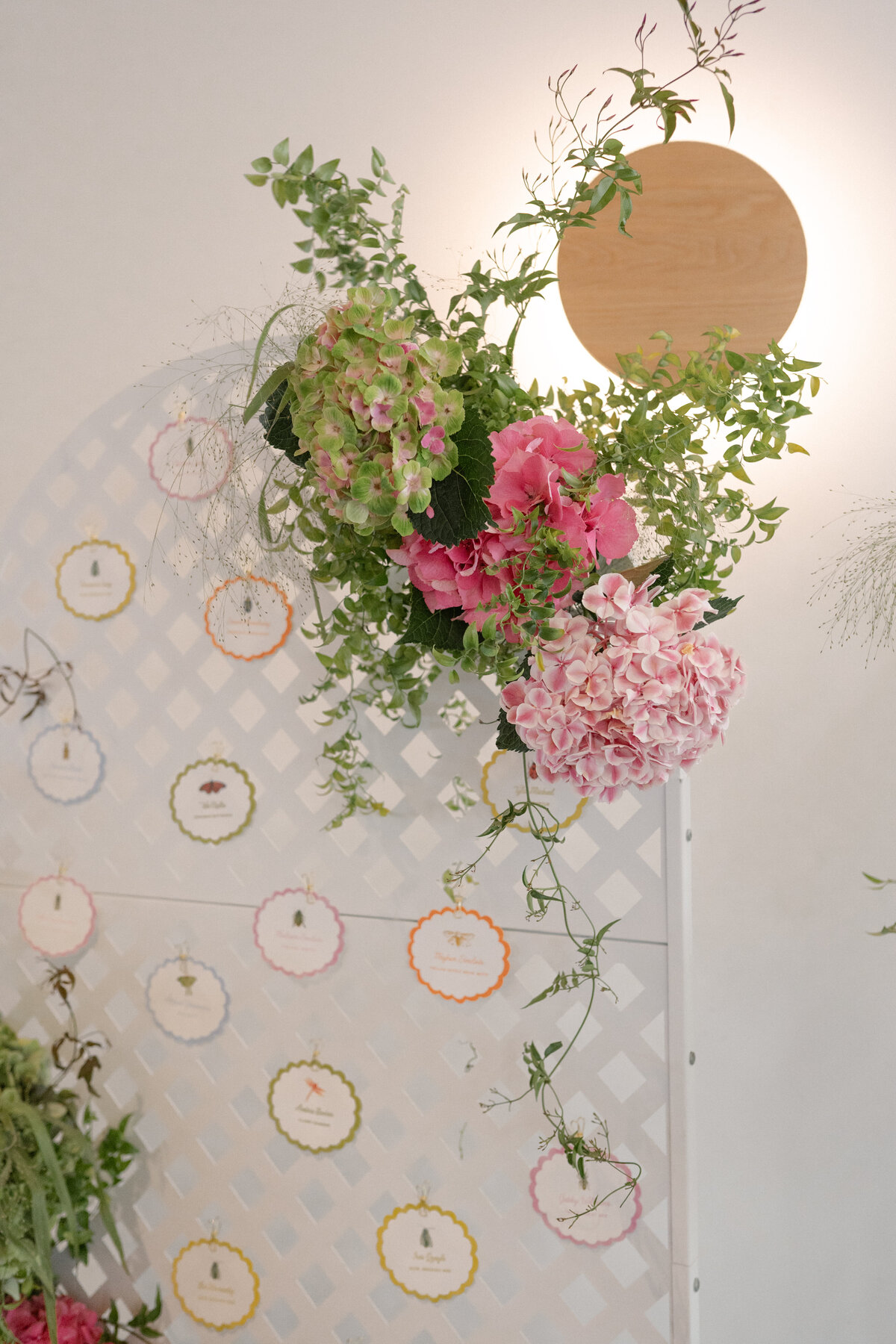 Colorful watercolor escort cards for cheerful garden party wedding by Dear Margo Designs with flower arrangements by Lovelilly Floral for an Austin, Texas wedding at The Grand Lady venue
