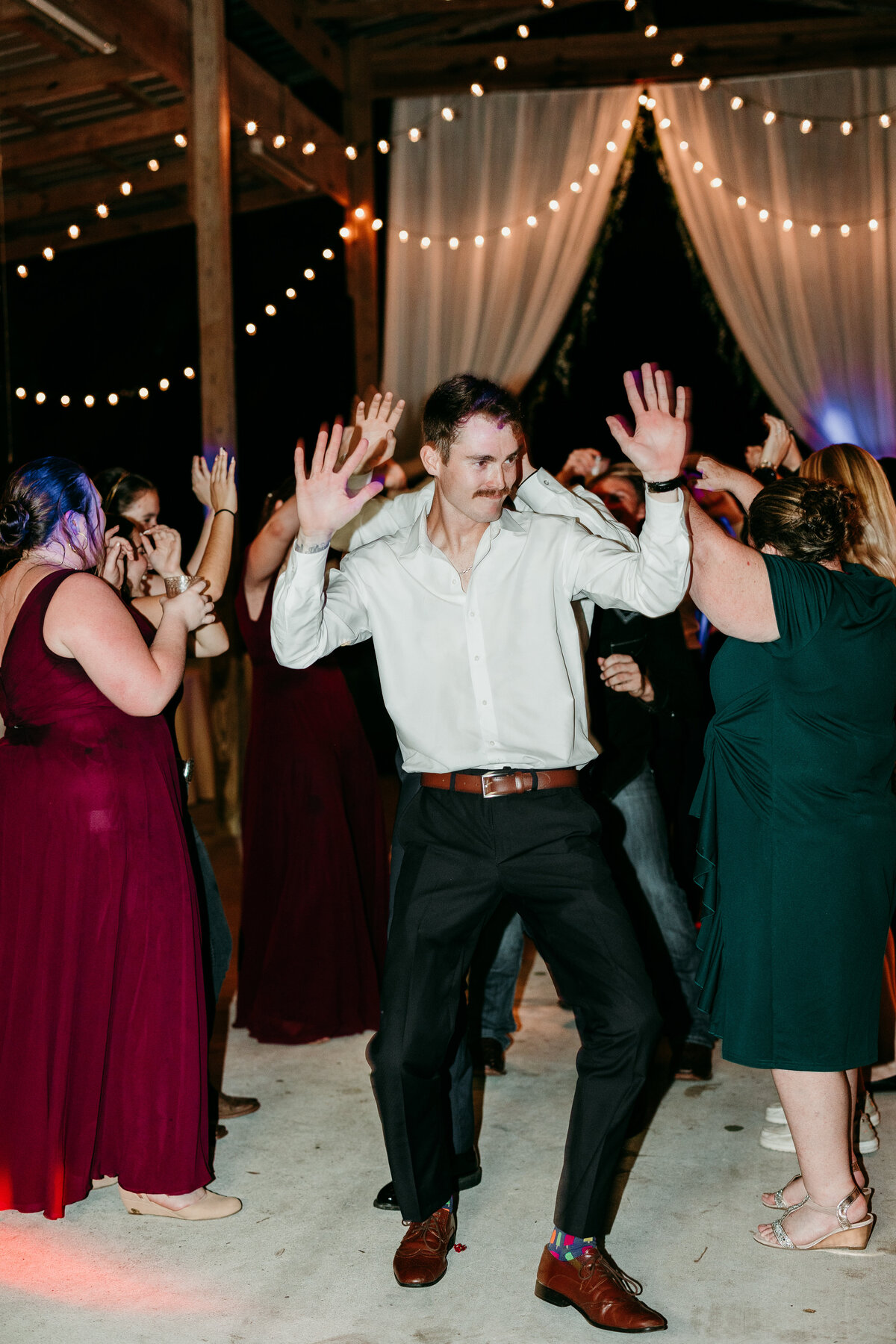 Male dancing at wedding reception