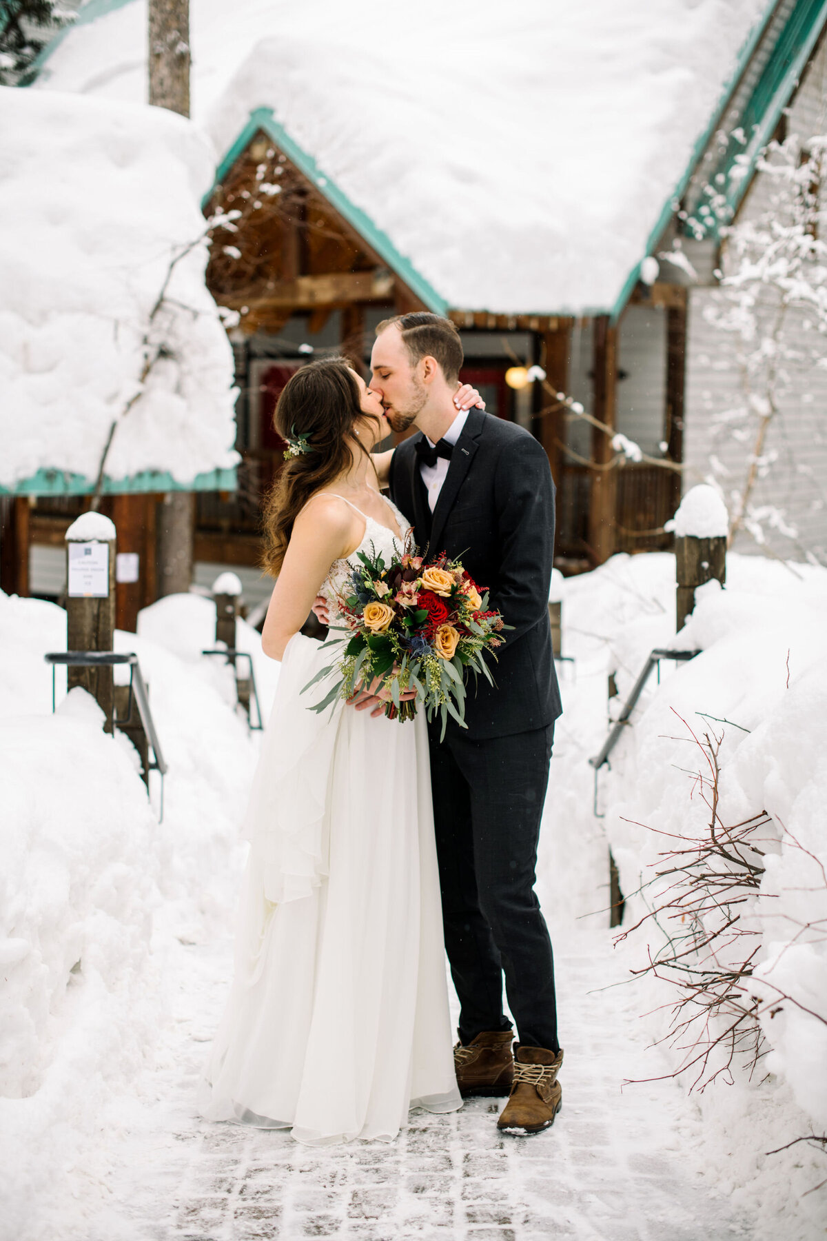 Outdoor winter wedding at Emerald Lake Lodge, rustic and classic Field, British Columbia wedding venue, featured on the Brontë Bride Vendor Guide.