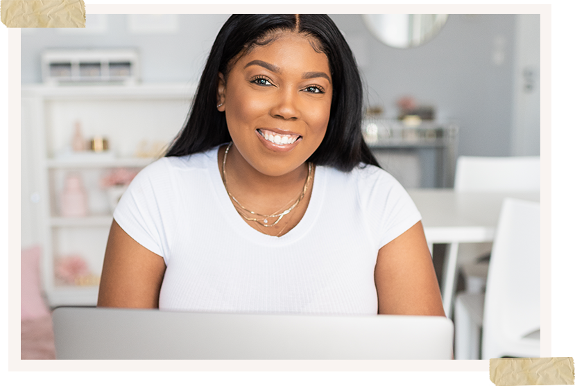 tampa bay black photographer sitting at computer smiling