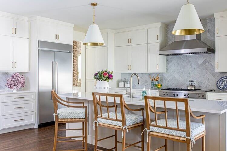 oyster creek studios highland park home kitchen with white cabinets and wooden stools