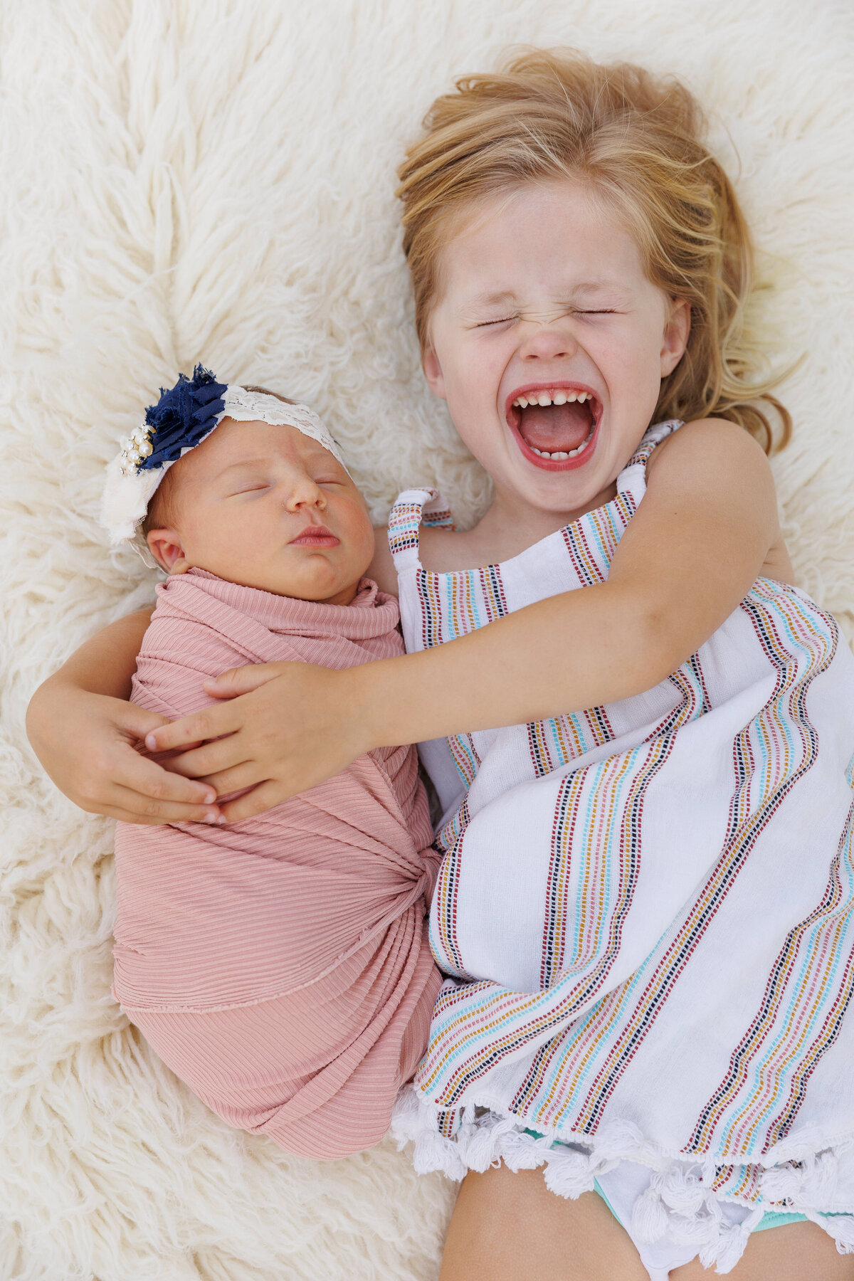 Baby sister and newborn together