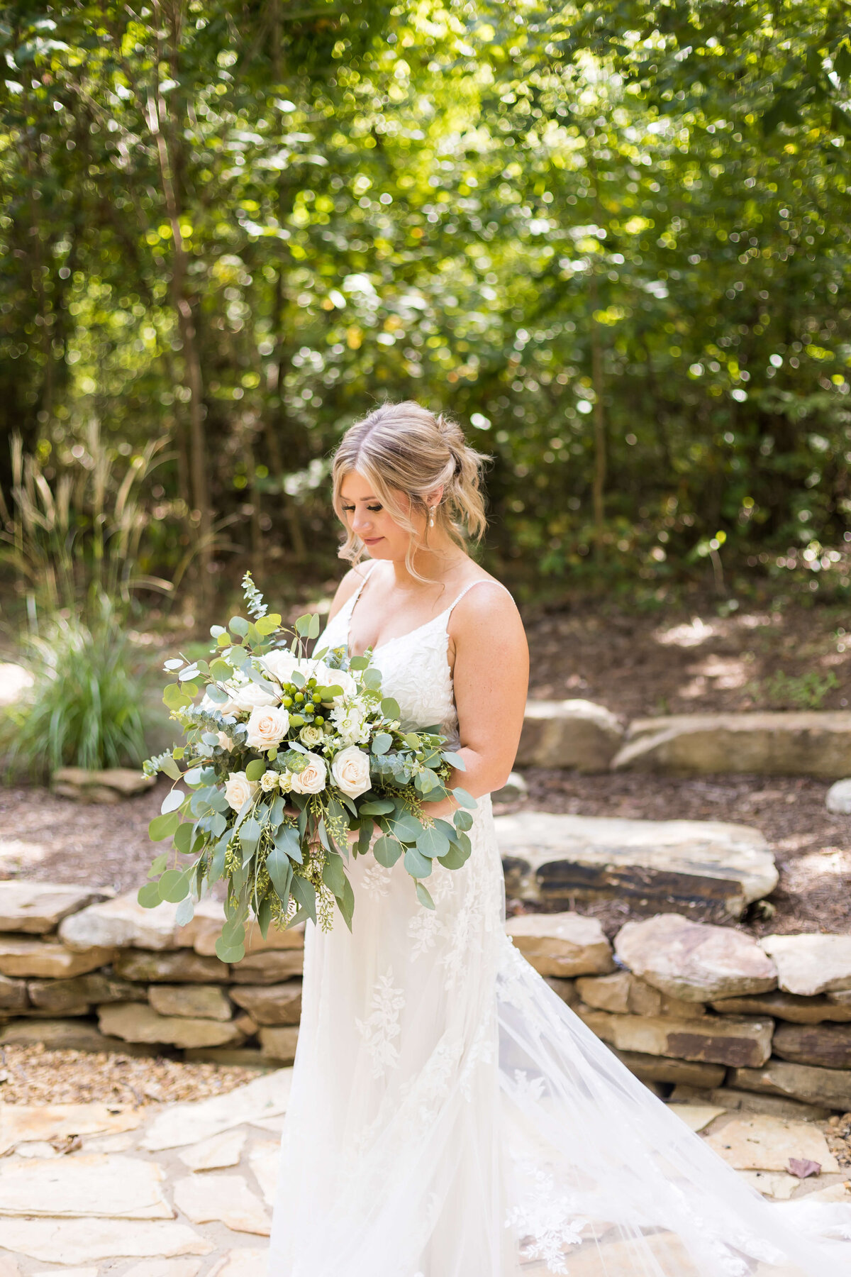 Bride holding bouquet at  The Barn at White Oaks, Murray, Kentucky