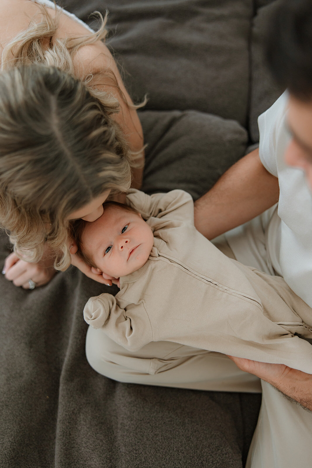 At home newborn session cuddled on the couch - Finger Lakes newborn session
