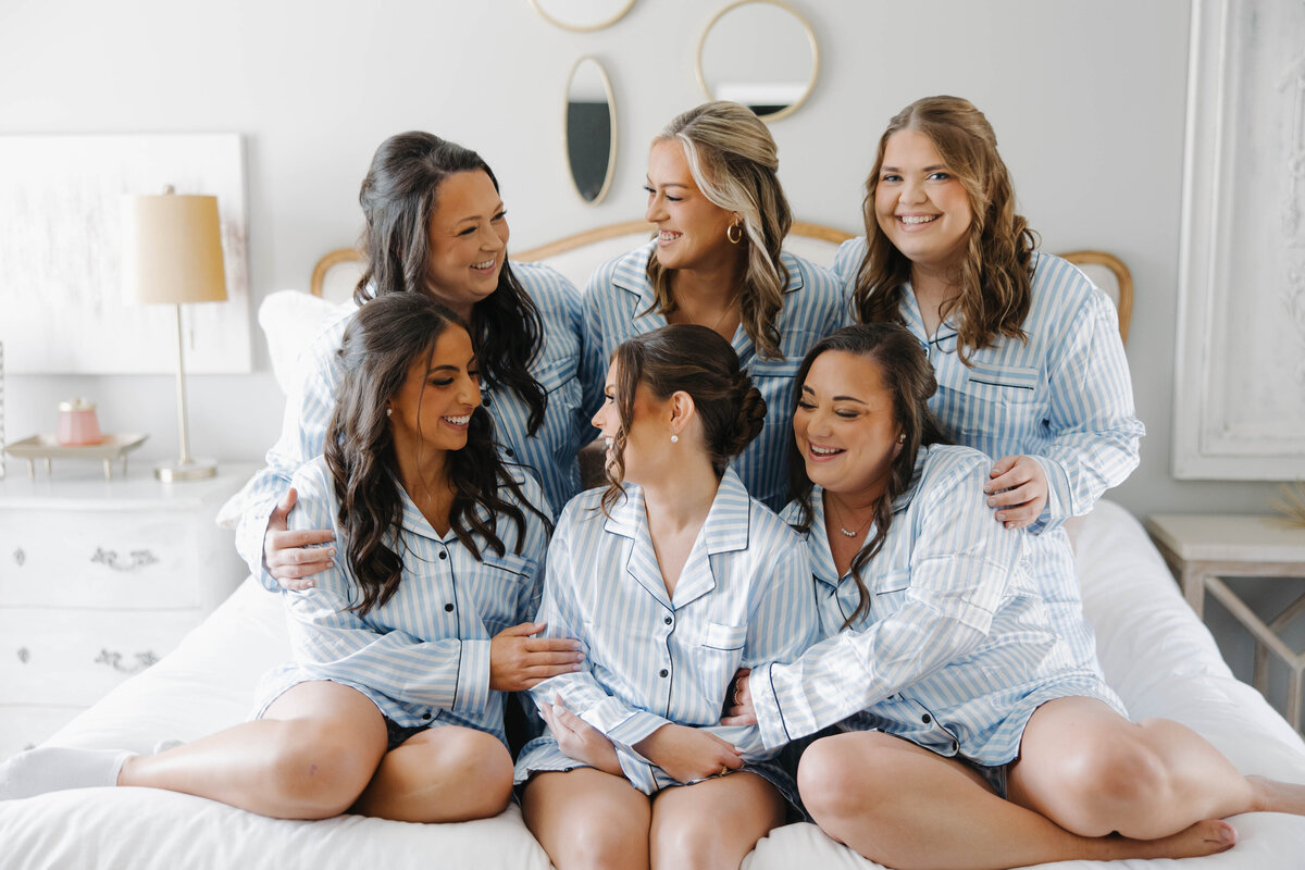 Bride and bridesmaids getting ready in matching pajamas