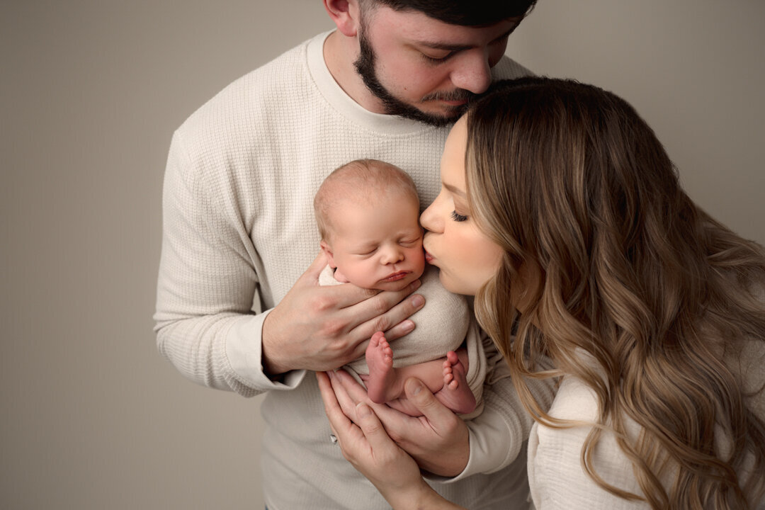 Grand Rapids Newborn Photography Mom Kissing Baby by For the Love of Photography