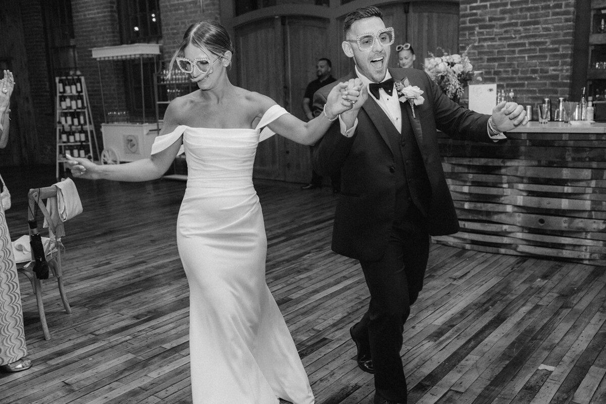 bride and groom enter city winery reception in hudson valley