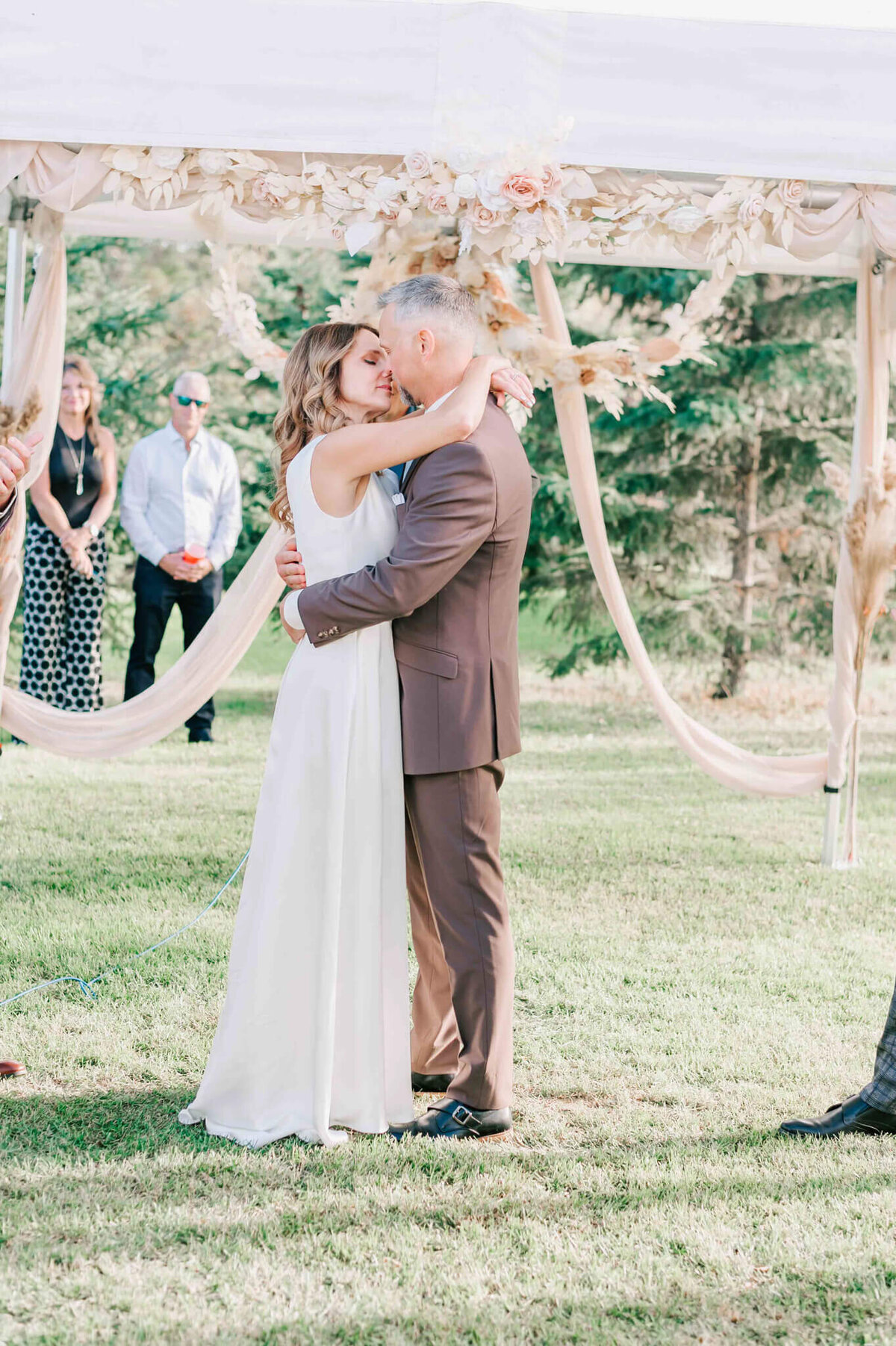 Bride and groom share their first kiss as husband and wife.