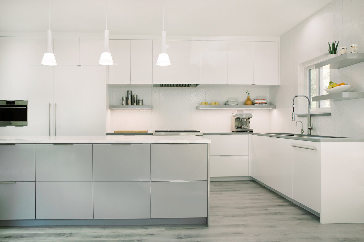 hello-home-sleek-modern-grey-and-white-kitchen-oversized-island-long-workstation-sink-austin-11