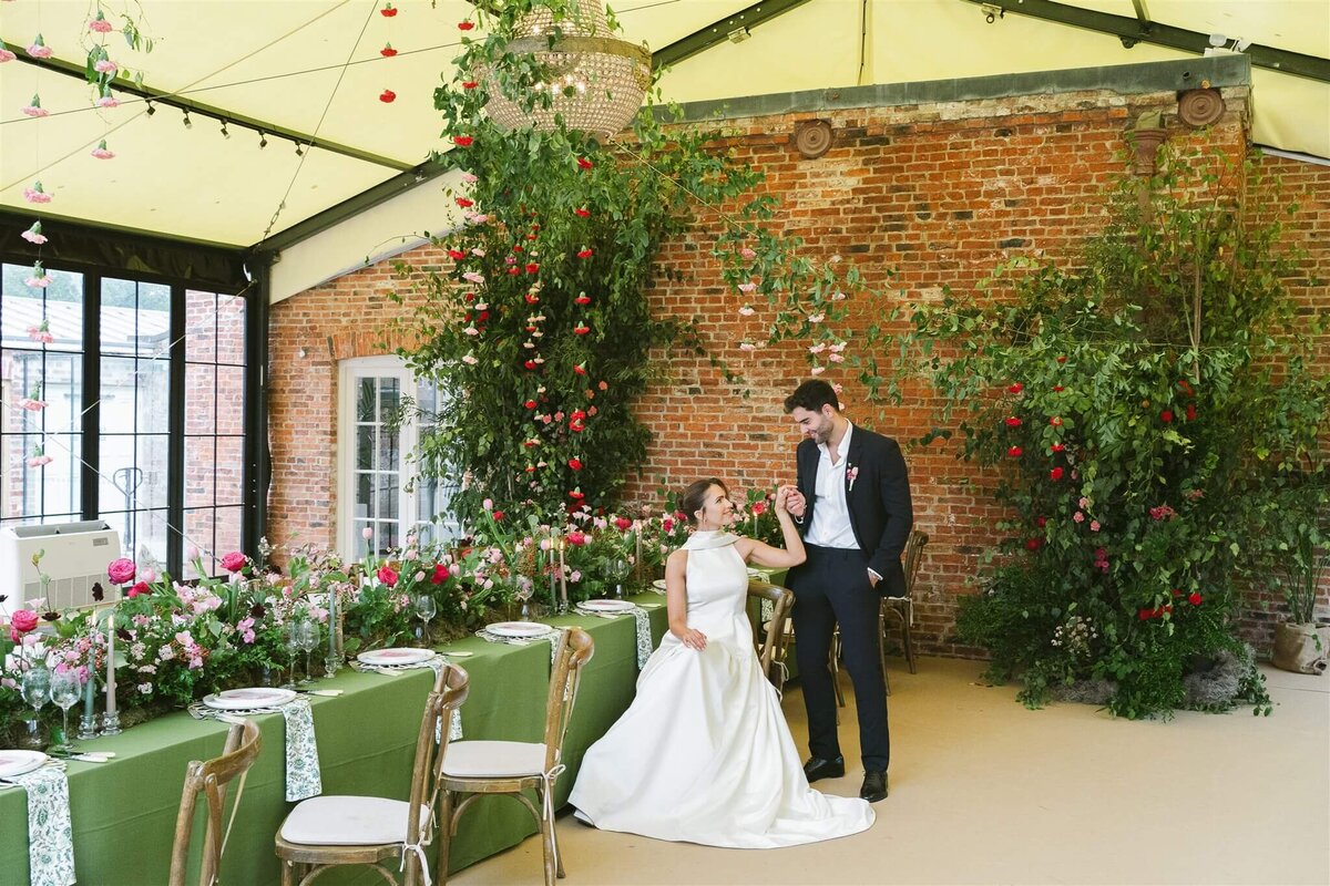 A stunning clear frame marquee for a wedding reception in front of a beautiful pool of water