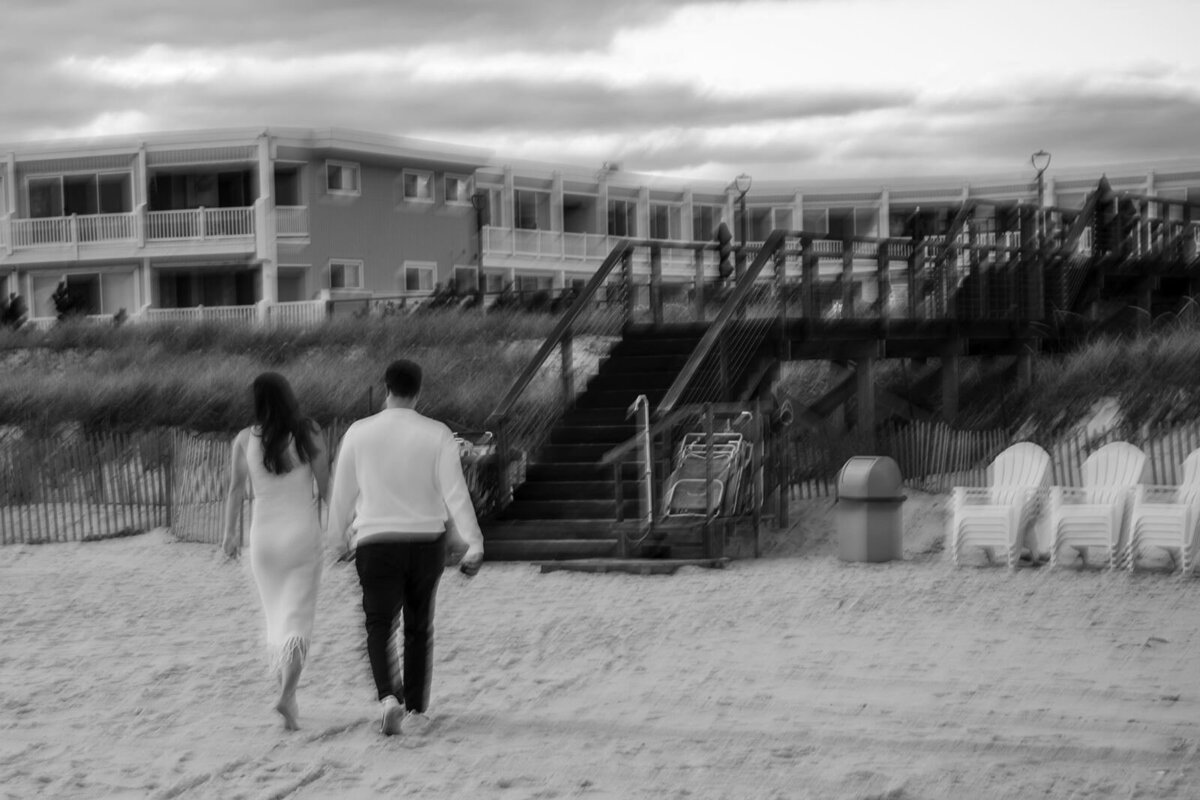 Editorial black and white of blurry picture as the couple walks off.
