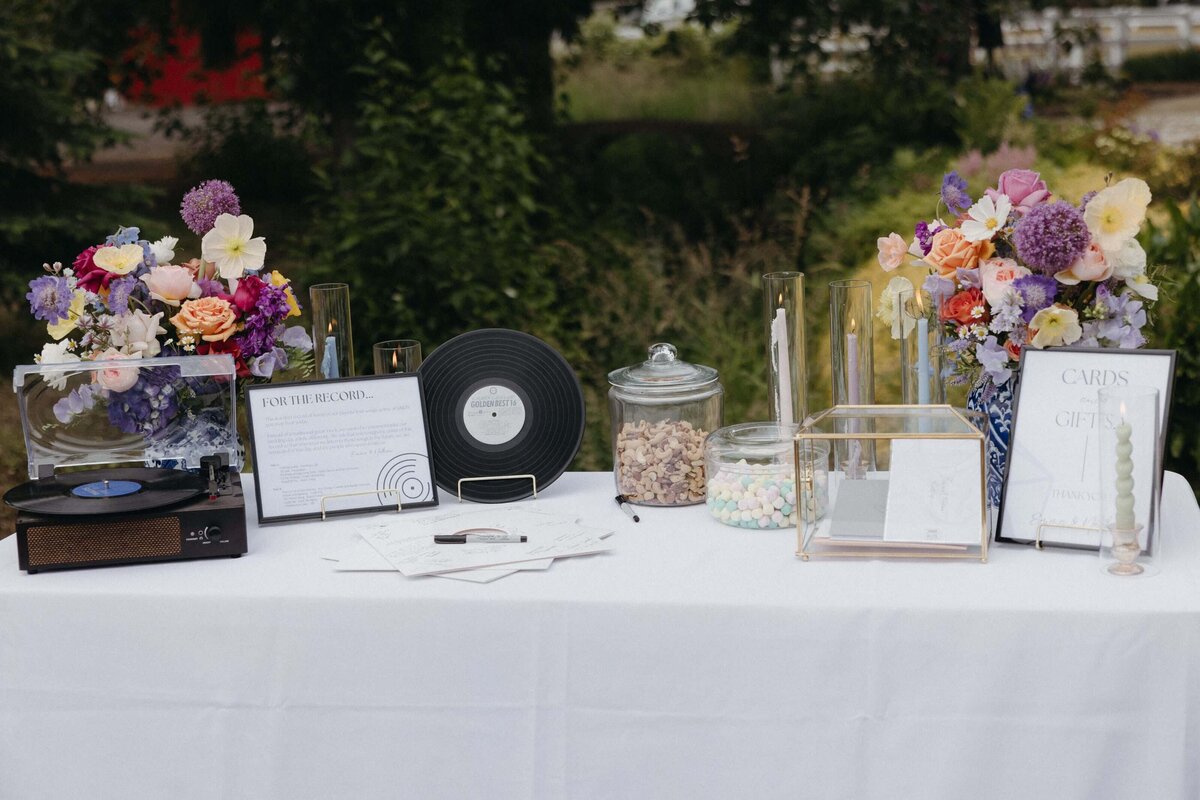 Floral arrangements by Eugene florist Flowers and Thyme sit on a table at a wedding reception.