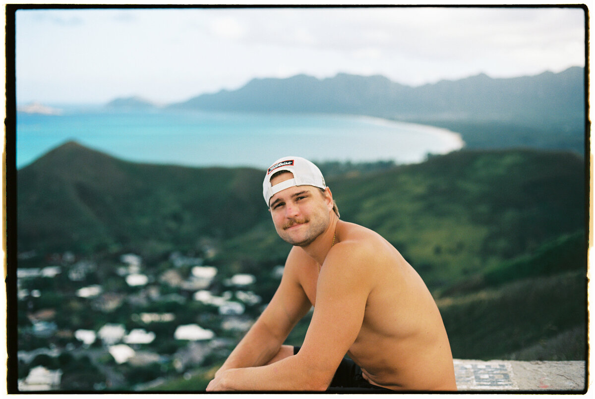 Portrait of a male smiling, captured on film by Kate Winters Photography, showcasing an authentic and candid moment in Carmel, California.