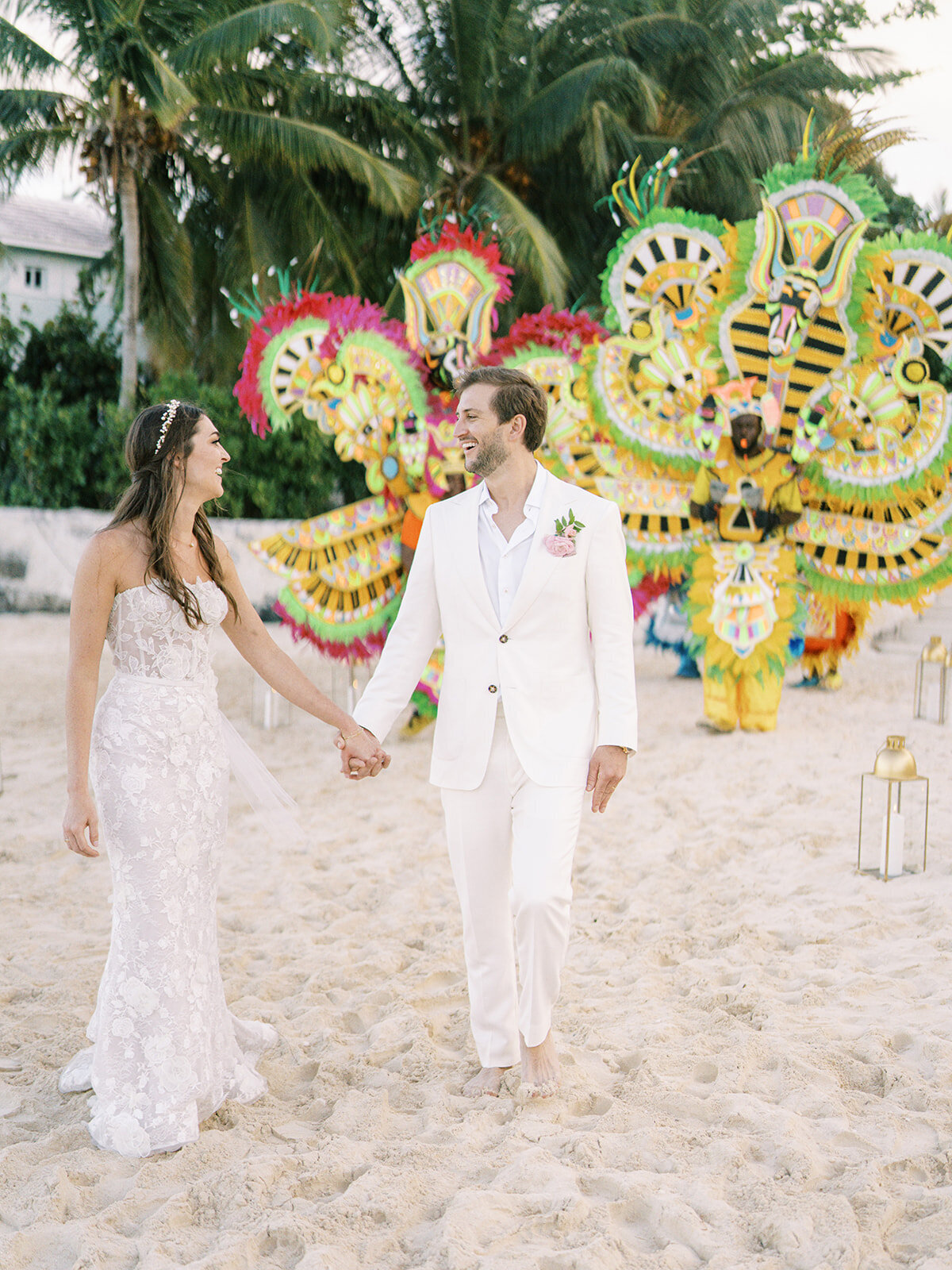 Dainty pink ranunculus boutonniere for spring beach wedding at private estate. Destination wedding in Exuma, Bahamas. Destination floral design by Rosemary & Finch Floral Design.